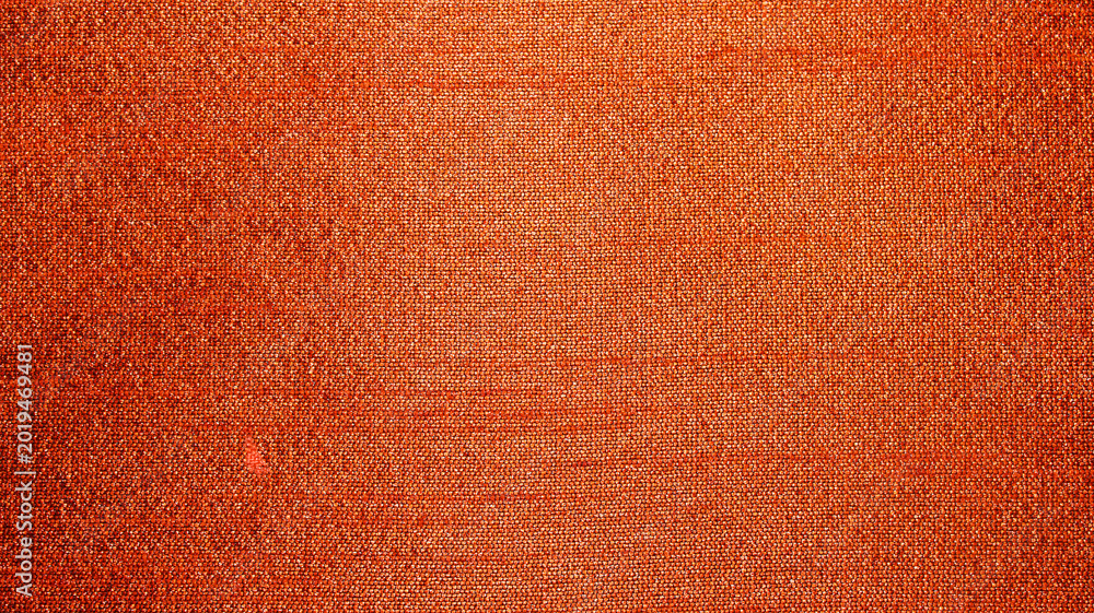 Fototapeta premium Warm Textured Fabric in Vibrant Orange for Artistic Use and Design