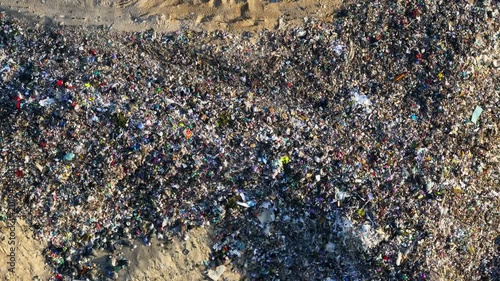 Landfill waste site shows plastic pollution and toxic waste disposal creating environmental hazards and public health threats