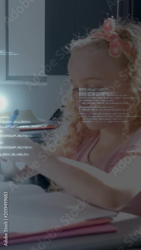 Vertical video: Student writing in book and turning pages, causing digital text and glows for study