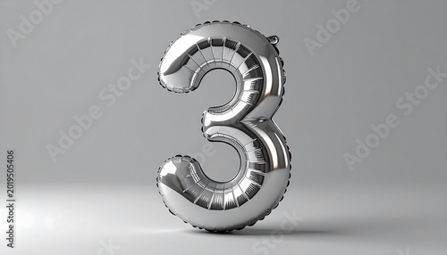 Shiny Silver Number Three Balloon Standing on Minimal Gray Studio Background