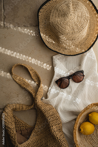 Sunny Travel Aesthetic Featuring Beach Bag Sunglasses And Hat On Stone Floor