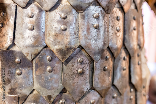 Closeup of a medieval knight's suit of armor and helmet. Close-up of knight's armor, Numerous breastplate and cuirass of a medieval knight.