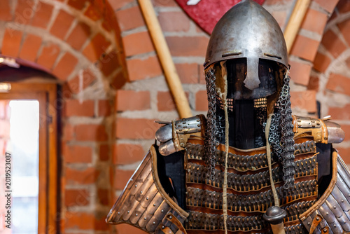 Bild auf Leinwand Closeup of a medieval knight's suit of armor and helmet