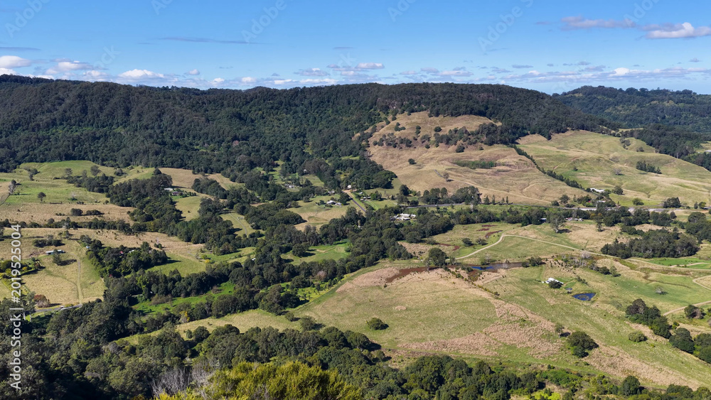 Fototapeta premium Panoramic Aerial View of Lush Green Hills and Rural Landscapes in Nimbin