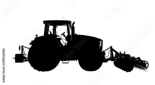 Photos Tractor with attached agricultural equipment in silhouette against a white backg