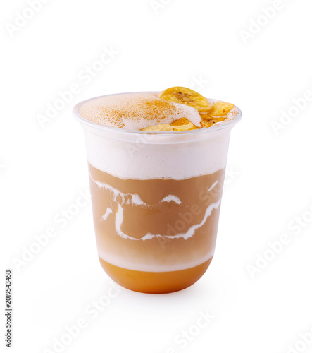 Iced caramel macchiato with banana chips topping on a white background