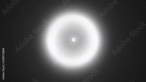 Glowing white light on black background.