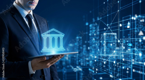 Businessman digital banking finance fintech financial technology bank investment business data network corporate professional holding tablet with glowing bank icon, city skyline background