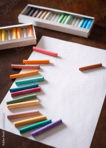 Set of colorful pastels laid out on a table