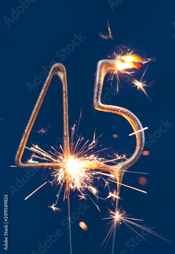 Canvastavla 45 years anniversary celebration festive background made with Bengal fires in the form of number Forty five