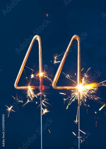 Konstfotografi 44 years celebration festive background made with Bengal fires in the form of number Forty four