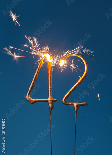 Canvastavla 42 years celebration festive background made with Bengal fires in the form of number Forty two