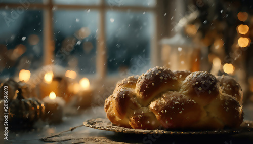 Braided bread ring dusted with sugar, set for a festive winter celebration