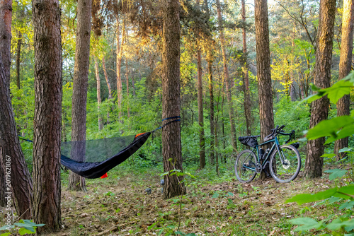 Camping with a hammock in the woods after cycling