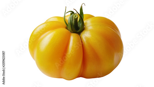 Foto Ripe yellow heirloom tomato with green stem, isolated on transparent background