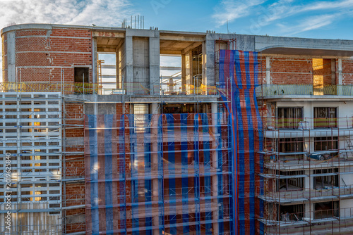 A major construction site for a luxury hotel in Rhodes Town, on the island of Rhodes, photographed by day and at dusk.
