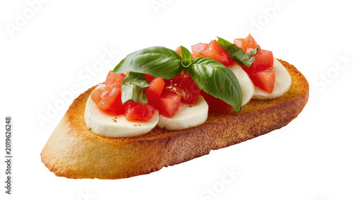 Fotografía Toasted bread slice topped with fresh mozzarella diced tomatoes and basil leaves