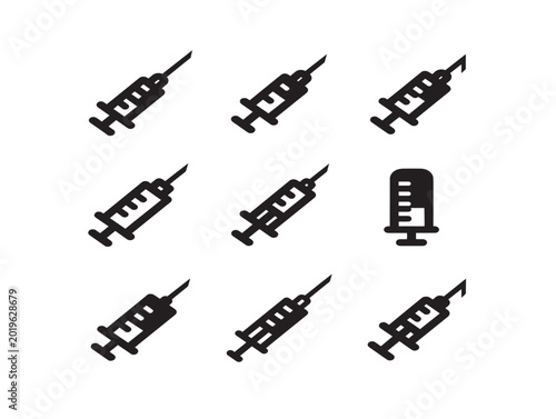 Set of vector syringes with needles in flat black line art illustration