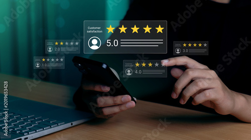 Hands using smartphone with virtual customer satisfaction rating interface,five-Star Service Quality Review,Customer Review and Feedback Analytics