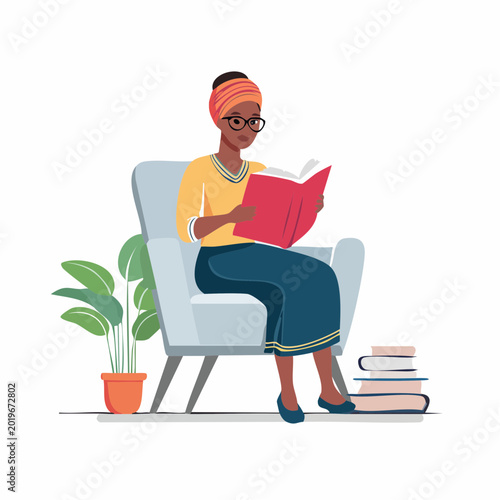 Woman Reading a Book While Sitting in an Armchair