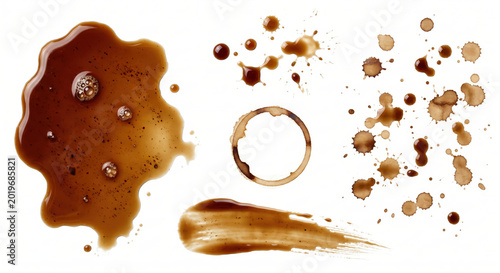 Collection of coffee splashes drops and rings on a clean surface stain