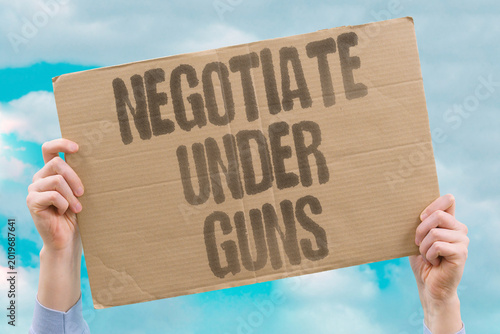 Tableau sur toile "Negotiate Under Guns" Negotiations happen under implicit military threat at the table