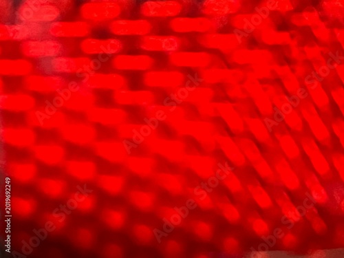 Abstract Texture of Red Plastic Tail Light Lens with Honeycomb Pattern