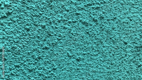 Canvas Print Close-up of coarse greenish textured wall emphasizing granular surface and consi