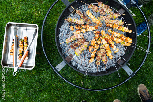 souvlaki being prepared on a grill