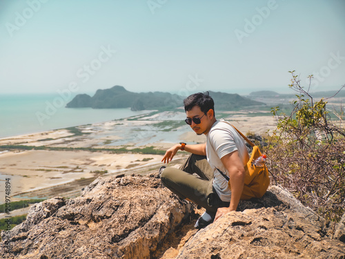 Foto Person crouching and examining path towards saltpans with determination