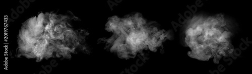 Abstract collection of white steam and smoke clouds isolated on black background. Dramatic swirling vapor textures with soft flowing shapes and atmospheric mist effect.