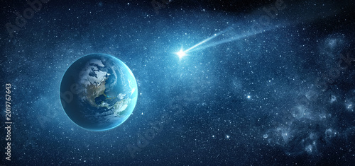 Foto Comet, asteroid, meteorite flying to the planet Earth on  starry night sky