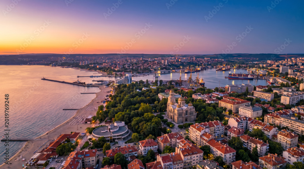 Fototapeta premium Aerial view of Varna city and the Black Sea coast at sunset.