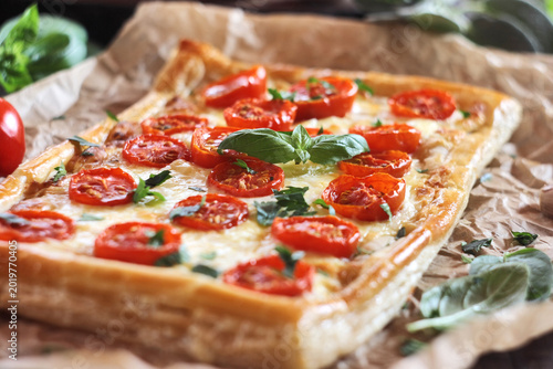 Obraz na plátně Cherry tomato puff pastry tart with mozzarella and cream cheese