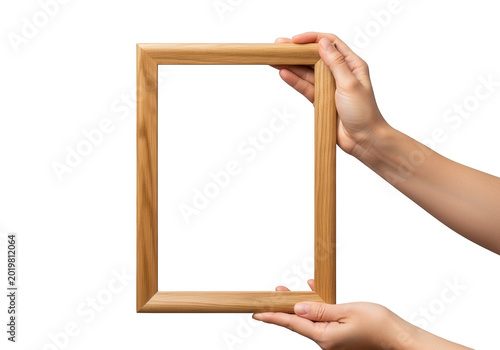 Hands holding a wooden picture frame isolated on transparent background