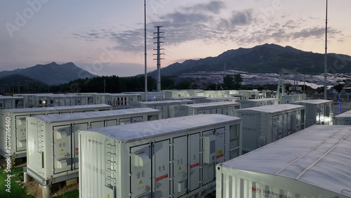 Energy storage power station with container arrays in mountainous area during twilight