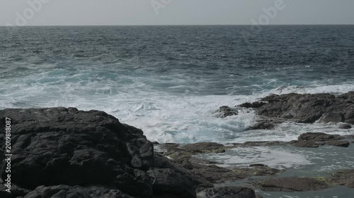 waves crashing on rocks