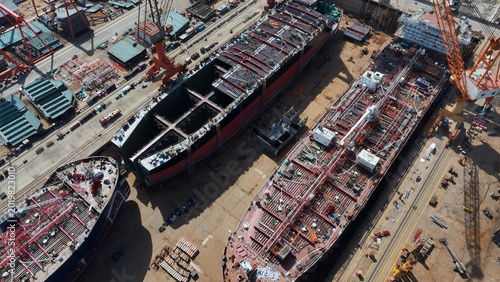 Cuadro en lienzo Shipyard construction site featuring large ship hull sections under assembly wit