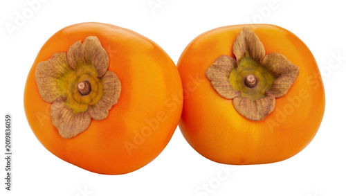 Schilderij op canvas Two ripe orange persimmons with green and brown calyxes, isolated on transparent