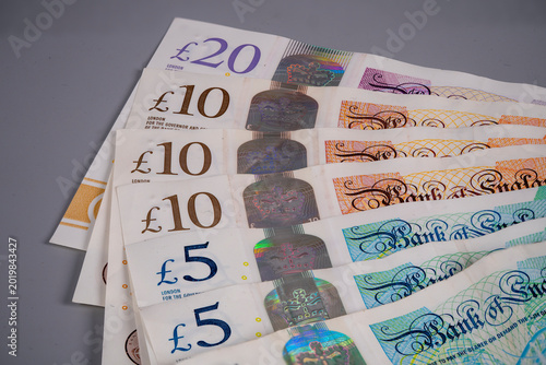 Konstfotografi Pound sterling notes on a table showing bank denominations and values