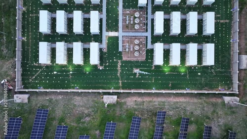 Aerial view of a large temporary modular building complex with organized green landscaping and infrastructure layout