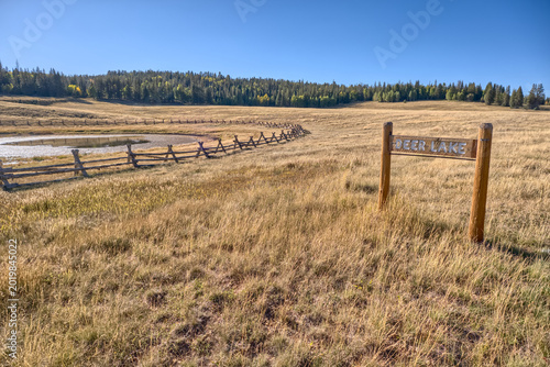 Deer Lake Sinkhole near sunset on the Kaibab Plateau in northern Arizona, with a wood fence preventing cattle access