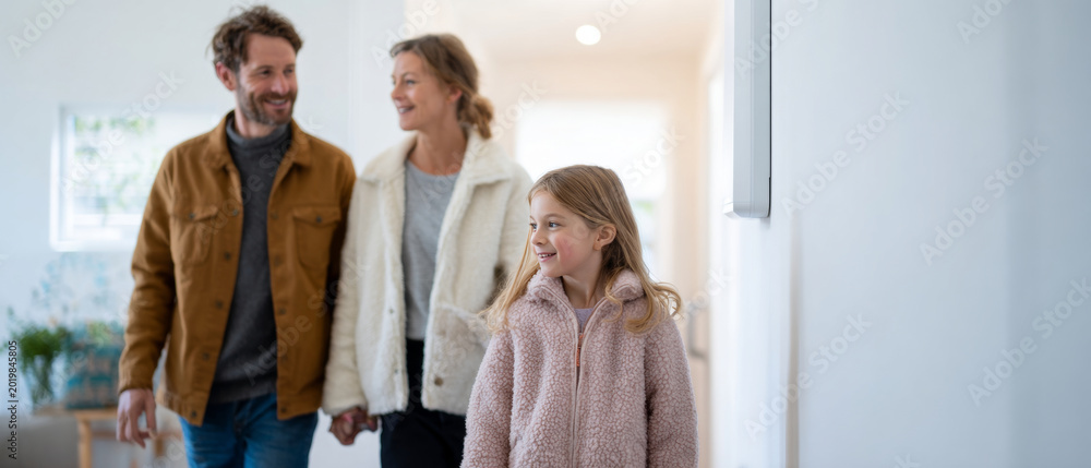 Obraz premium Happy family walking indoors together