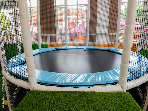 Cuadro en lienzo Round Trampoline with Safety Net in Indoor Play Area