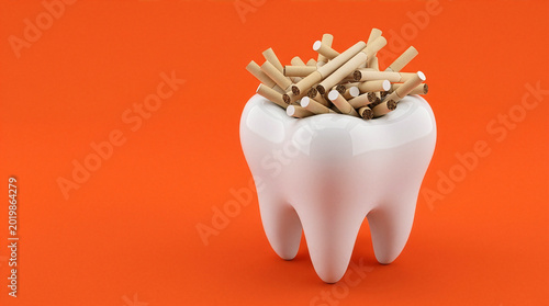 White 3D tooth model filled with unlit cigarettes on orange background