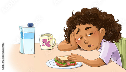 Little girl half asleep after breakfast