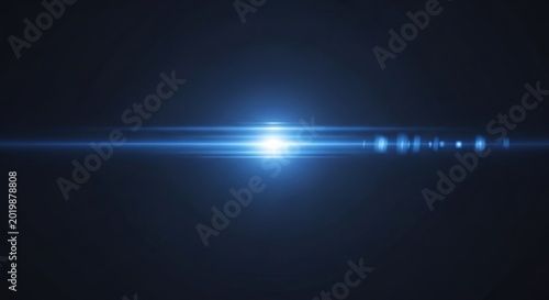 Bright Blue Lens Flare Effect on Dark Background.