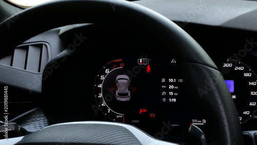 Photography Illuminated doors and power indicators, mileage and fuel consumption readings on