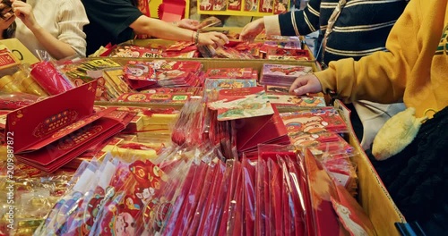 Taipei, Taiwan, February 4, 2026: Customers select colorful red envelopes on Dihua Street on the eve of the Lunar New Year.