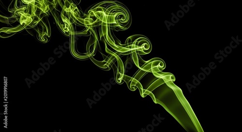 Wisps of bright green smoke swirling against a black background with smoke trail